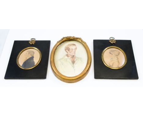 A pair of Regency oval portrait miniatures, c.1820, half length husband and wife in profile, watercolour/pencil, unsigned, in