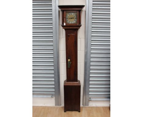 An early 19th century oak eight day longcase clock, the hood with a projecting cornice, fitted with a single door, set betwee