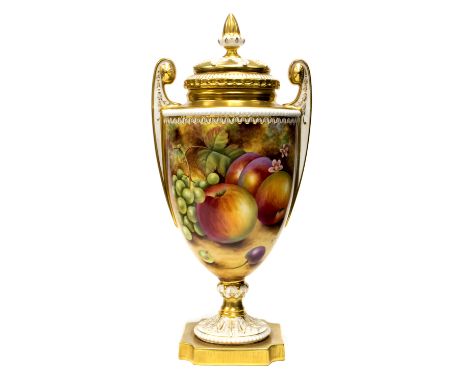 A Royal Worcester fruit painted vase, Neoclassical pedestal urn form, with stylised handles and relief moulded lid, painted w