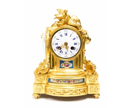 A French ormolu boudoir bracket clock, 19th Century, of Baroque design, embracing bird finial, circular enamel dial with blue