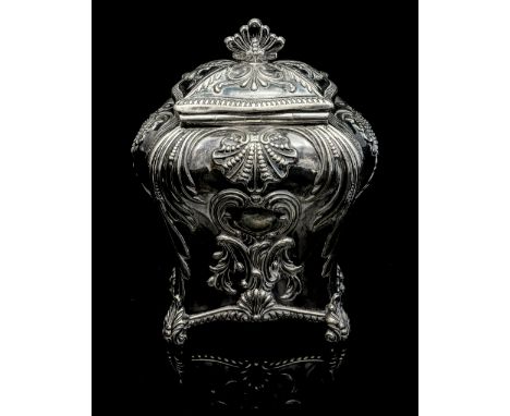 A Victorian silver tea caddy modelled in the early George III style of circa 1760, of bombe form, with rococo style C scroll,