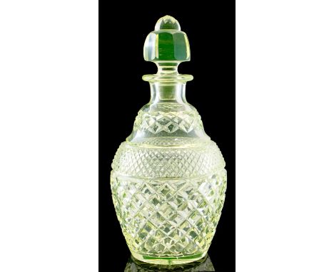 A 19th century uranium glass decanter, circa 1835, hobnail and diamond cut ogee ovoid form, with cushioned facet cut stopper,