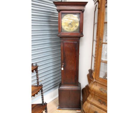 An 18th century oak 30 hour longcase clock, the brass dial inscribed 'Adam Cleak, Bridport', the hood with a projecting corni