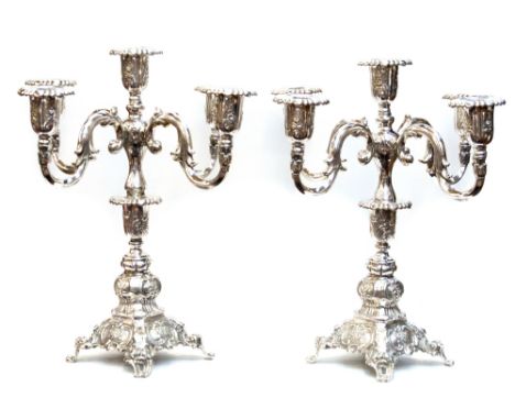 A pair of late nineteenth century cast Continental, possibly German, five-light candelabra,  each with removable central colu