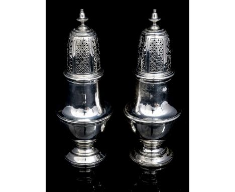 Tiffany & Co London, A pair of sterling silver casters in the George II style, each of baluster form with a pierced dome cove