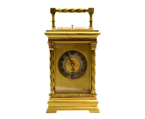 A 19th century French gilt brass carriage clock, the silvered 2 inch chapter ring housed within a five window case with wryth