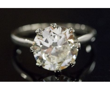A diamond solitaire ring, the claw set round brilliant cut diamond measuring approximately 2.35ct, band marked 'Plat', assess