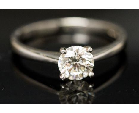 A diamond solitaire ring, on a platinum band stamped .950, approximately 0.75ct, VS clarity, J-K colour