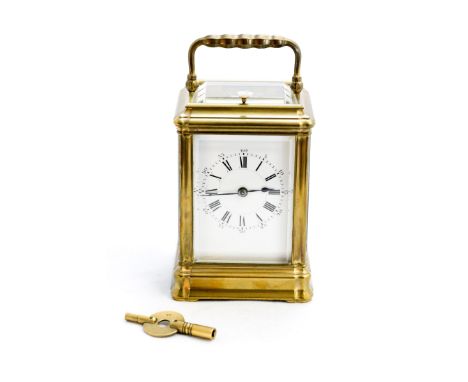 A 19th century French gilt brass repeating carriage clock by Henri Jacot, The white enamelled dial with Roman numerals within