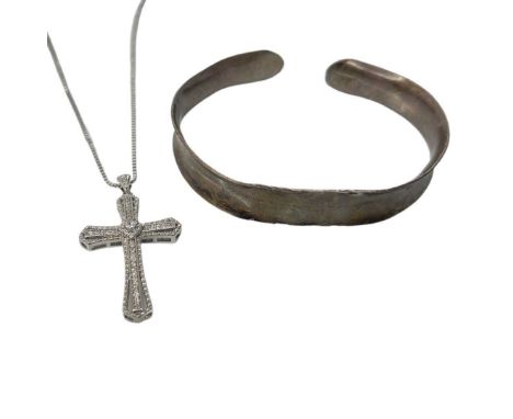A White Metal Bangle and Cross Necklace.assorted sizes Good condition.