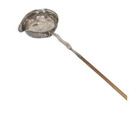 Georgian Silver Toddy Ladle. c.1809Unusual wavy stem with engraving 'M.H, I.H, 1809'Length 36.5 cmsDings to bowl