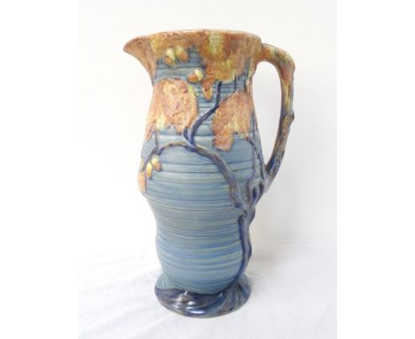 1930's CARLTON WARE OAK TREE PATTERN LARGE JUG
with a blue ground shaped ribbed body and branch style handle, 35.5cm high  