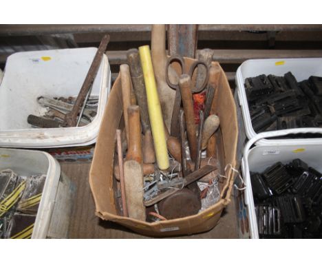 A box of lead beating tools etc.