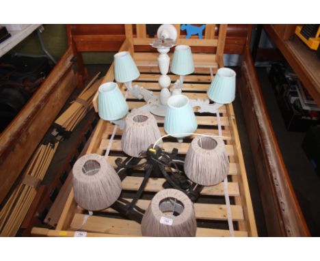 A wooden five branch chandelier together with a metal light fitting 