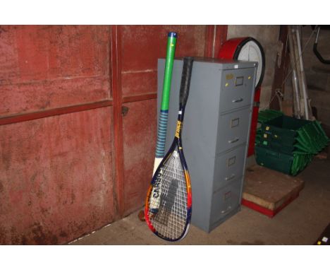 A novelty squash racket together with a novelty hockey stick