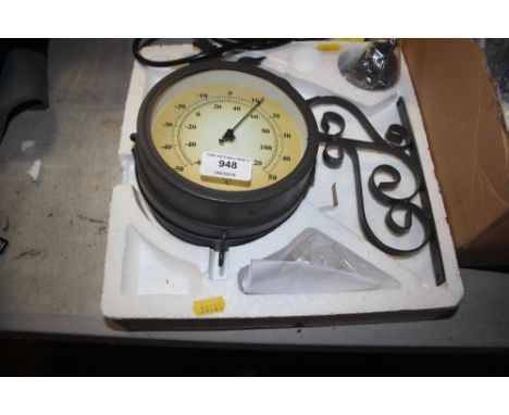 An outdoor clock thermometer