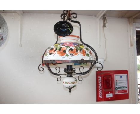 A pottery and wrought iron hanging light fitting