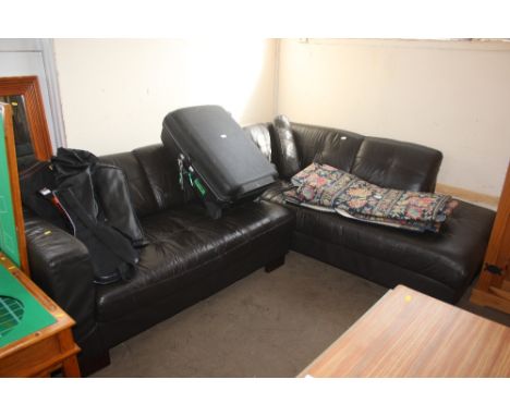 A black leather upholstered corner sofa