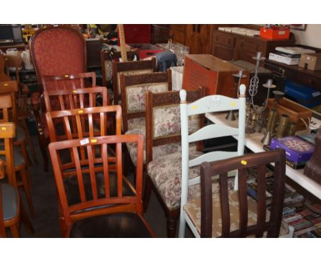 A set of four oak upholstered dining chairs together with a blue painted ladder back chair 