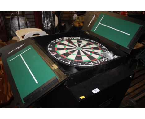 A Dunlop dart cabinet and board