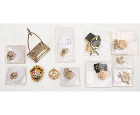 A collection of gold Masonic fobs and badges:, including a 9ct gold and enamel badge for Brent lodge, an 18ct gold circular p