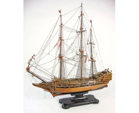 A scale model of a Royal Navy man-o-war:, standing and running rigged  over decks with grates, three quarter rear galley, ope