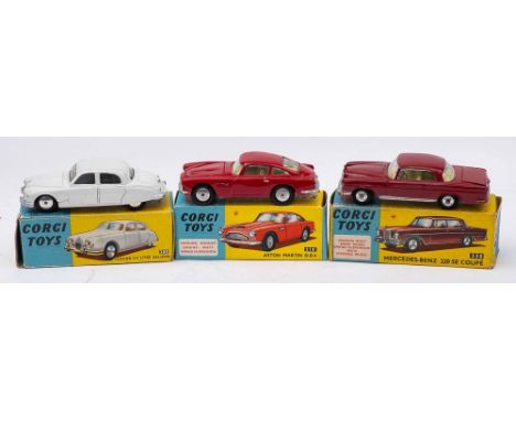 Corgi 208 Jaguar 2.4 litre saloon:, white with spun hubs, Corgi 218 Aston Martin DB4 with repainted red body and Corgi 230 Me