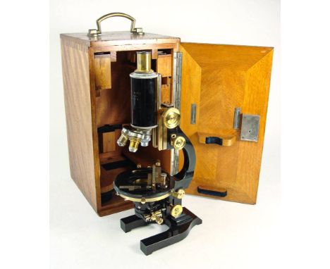 An Ernst Leitz Wetzlar brass and lacquer microscope:, No 209079, signed as per title, coarse and fine rack and pinion focus w