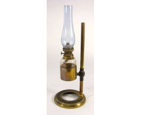 A Victorian gilt brass microscope lantern:, unsigned, the chimney and bottle in a cylindrical mount on a sliding  bracket and