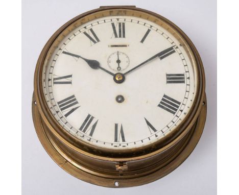 A Circular brass bulkhead clock by Astral, Coventry: Roman numeral enamel dial with subsidiary seconds dial, 25.5cm diameter.
