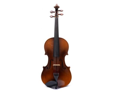 A Czechoslovakian copy of a Stradivarius violin: scroll carved headstock, ebonised headstock and two piece back, together wit