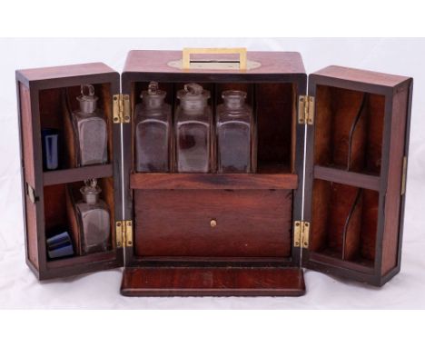 A 19th century mahogany apothecary's box:, the double section front fitted bottle shelves to interior with a further four bot