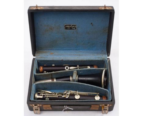 A French rosewood clarinet by J Thibouville Lamy: No 31330 signed as per title with silver plated mounts in a fitted case.