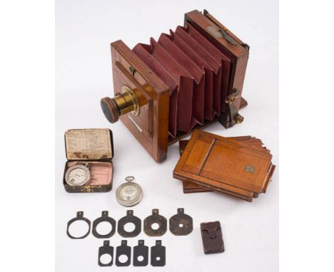 A mahogany and brass 'The International' three quarter plate camera by J Lancaster &amp; Son, Birmingham: signed as per title