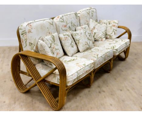 A stylish bamboo 1970s shaped cane frame sofa with loose cushions (h.80cm x l.190cm x w.75cm)