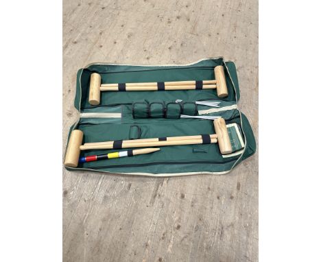 A Jaques unused modern canvas cased travelling croquet set complete with four mallets, hoops, balls and instructions: case l.