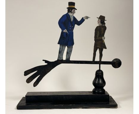 Ramsay Gilles, Contemporary Folk Art inspired painted sheet metal rotating sculpture of a Gentleman pointing his finger at th