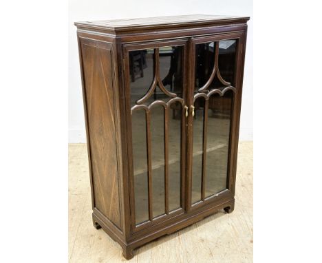 A modern Korean style hardwood glazed door bookcase with shelved interior (h.124cm x l.85cm x w.43cm)