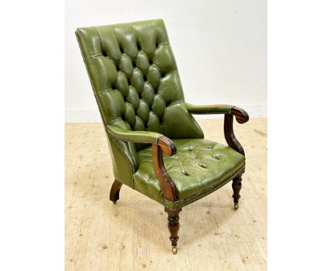 A reproduction mahogany framed Regency style button back and seat library/reading chair in deep green distressed leather (h. 