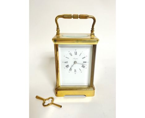 An Angelus French brass carriage clock with winding key and bevelled glass top (h. x 17.5 cm w. x 9 cm d. x 8 cm)