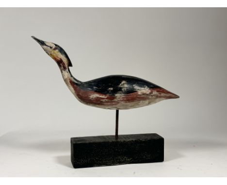 Ramsay Gilles, Folk Art inspired hand-painted wooden sculpture of a Grebe, raised on a wooden base. (initialled verso) (h-39.