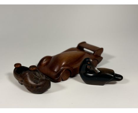 A hand-carved by B. Frost (Peebles) wooden racing car, a Dutch clog carved decorative trinket container and a wooden carved m