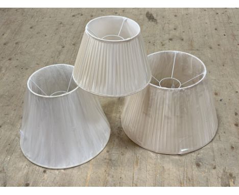A group of three new table lamp shades largest silk : h. x 36cm x l. x 56cm, smallest silk h. x 26cm l. x 40cm (3)