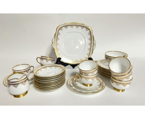 A Royal Albert gilt china part tea service comprising a desert/sandwich plate or tea stand, twelve tea plates, twelve saucers