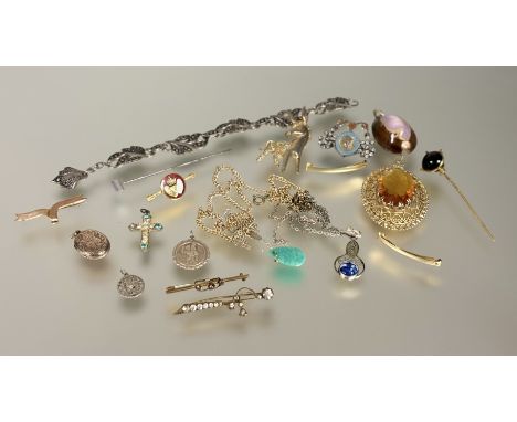 A collection of costume jewelelry to include; a 9ct gold bow brooch: l. x 4cm 2.29g, a cowrie shell pendant, gilt brooches, g