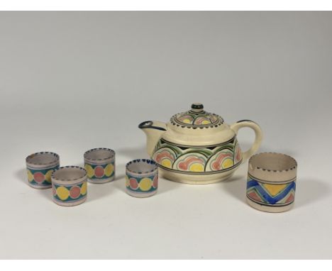 A Collard Honiton Pottery teapot (l-19cm), with a set of four small pots (h-4cm) and a sugar pot (h-6cm) (marked verso) (6)