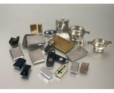 A collection of lighters to include; two vintage white metal Dunhill lighters and a gilt lighter, a vintage Dupont gilt light