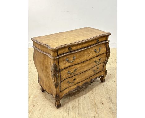 A pretty reproduction commode chest in French country style, with distressed finish, with an arrangement of four long drawers