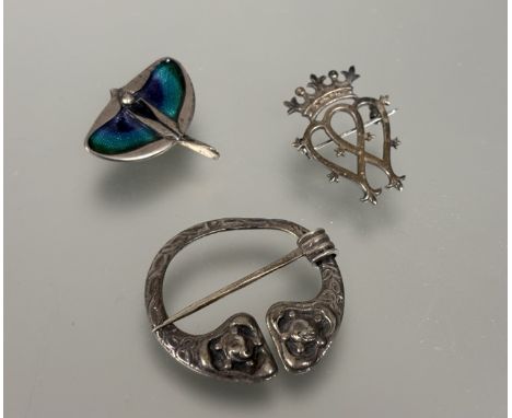 A Celtic silver penanular style brooch: d. x 5cm, an Edinburgh silver luckinbooth style brooch: h.x 4cm and a silver enamel A