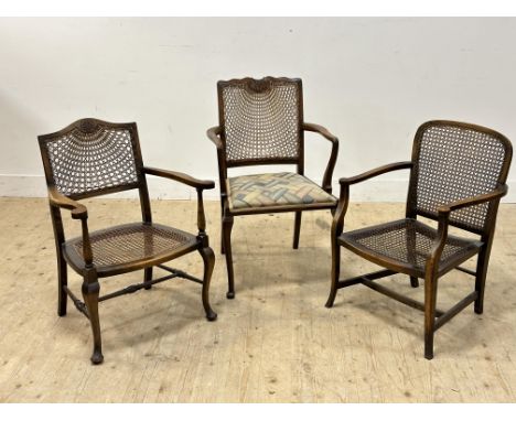 A group of three 1920s vintage stained beech cane back and seat open arm chairs: tallest h. x 87cm (3)